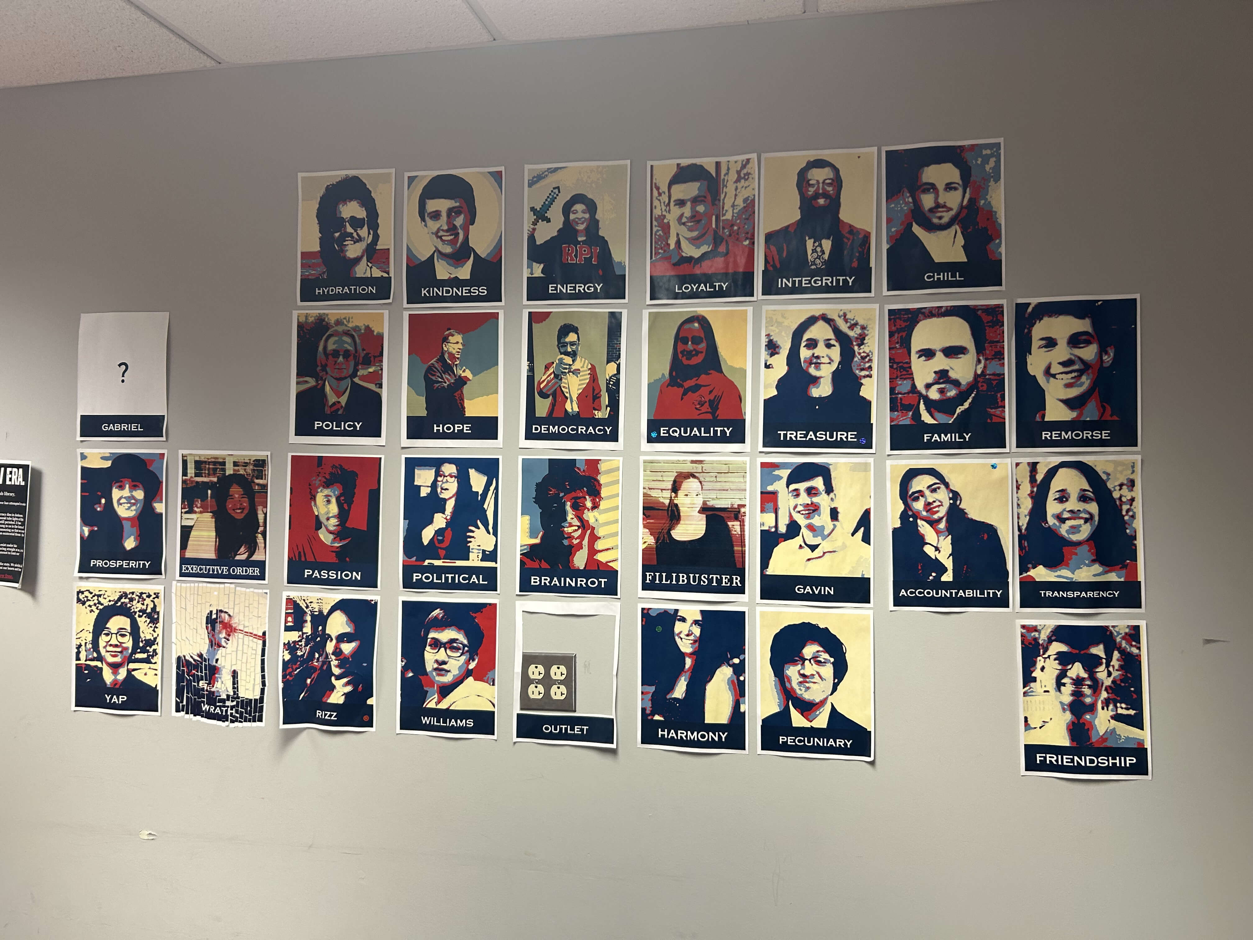 The Club Library back wall. There are a number of posters of student government members.